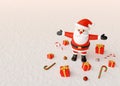 Merry Christmas, Santa Claus standing with gifts and Christmas ornaments on a snow ground Royalty Free Stock Photo