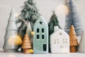 Merry Christmas! Christmas scene, miniature holiday village with lights. Christmas houses and trees Royalty Free Stock Photo