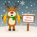 Merry Christmas Sign with a Cute Reindeer Royalty Free Stock Photo