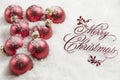 Merry Christmas Sign and Ornaments in Snow Royalty Free Stock Photo