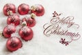 Merry Christmas Sign and Ornaments in Snow Royalty Free Stock Photo