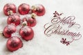 Merry Christmas Sign and Ornaments in Snow Royalty Free Stock Photo