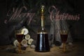 Merry Christmas Sign With Red Wine Vintage Bottle and Glasses Re Royalty Free Stock Photo