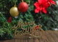 Merry Christmas sign with Christmas tree decorations. Royalty Free Stock Photo