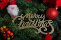 Merry Christmas sign with Christmas tree decorations. Christmas background Royalty Free Stock Photo