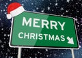 merry christmas on signpost or billboard against starry sky at christmas or xmas night. Concept Image Royalty Free Stock Photo