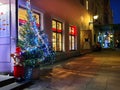 Merry Christmas Snowman ,Christmas tree illumination and snowman in red hat and pant at night street in Tallinn Old Town Royalty Free Stock Photo