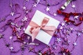 Merry Christmas or St Valentines Day card made of decorations, white gift boxes with pink ribbon, sparkles and confetti Royalty Free Stock Photo