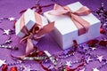 Merry Christmas or St Valentines Day card made of decorations, white gift boxes with pink ribbon, sparkles and confetti Royalty Free Stock Photo