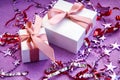 Merry Christmas or St Valentines Day card made of decorations, white gift boxes with pink ribbon, sparkles and confetti Royalty Free Stock Photo