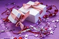 Merry Christmas or St Valentines Day card made of decorations, white gift boxes with pink ribbon, sparkles and confetti Royalty Free Stock Photo