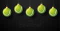 Merry Christmas Tennis greeting card. Hang on a thread Tennis ball as a Christmas ball on black horizontal background. Sport