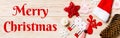 Merry Christmas text. Banner top view of Christmas decorations and toys on wooden background. Copy space. Empty place Royalty Free Stock Photo