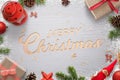 Merry Christmas text carved in a wooden surface and surrounded by Christmas decorations Royalty Free Stock Photo