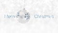 Merry Christmas text and hanging silver ball decorated with shiny snowflake dangling isolated on snowing background, white