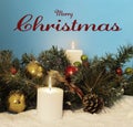 Merry Christmas text with pine fir, candles, ornaments Royalty Free Stock Photo