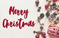 Merry christmas text, seasonal greetings card sign. flat lay. mo Royalty Free Stock Photo