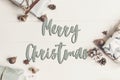 Merry christmas text, seasonal greetings card sign. flat lay. pr Royalty Free Stock Photo