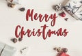 Merry christmas text, seasonal greetings card sign. wrapped pres Royalty Free Stock Photo