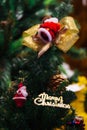 Merry Christmas Text Sign Ornament Attached On Xmas Tree - Selective Focus.