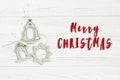 Merry christmas text sign on simple vintage toys on stylish whit Royalty Free Stock Photo