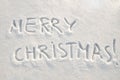 Merry christmas text on snow Royalty Free Stock Photo