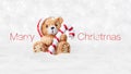 Merry Christmas text and teddy bear with red hat and candy striped cane stick isolated on snowing background, white Christmas