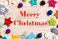 Merry Christmas text. Top view of Christmas decorations and toys on wooden background. Copy space. Empty place for your Royalty Free Stock Photo