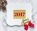 Merry christmas 2017 text in vintage white picture frame with pi