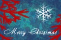 Merry Christmas text in white color on blue background with red christmas tree branches.