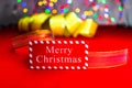 Merry Christmas text wooden sign, decorations and ornaments in a colorful Christmas composition Royalty Free Stock Photo