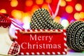 Merry Christmas text wooden sign, decorations and ornaments in a colorful Christmas composition Royalty Free Stock Photo