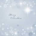 Merry Christmas text written on blue Christmas sparkly bright background. Christmas card.