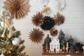 Merry Christmas! Christmas tree, little house, fir, lights, stars. Modern scandi decor. Magic Winter Royalty Free Stock Photo