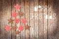 Merry Christmas, tree made with wooden rustic ornaments on wood background Royalty Free Stock Photo