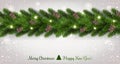 Merry Christmas Typographical on white background with garland of tree branches decorated with stars, lights, snowflakes. Royalty Free Stock Photo