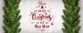 Merry Christmas Typographical on white background with garland of tree branches decorated with stars, lights, snowflakes. Royalty Free Stock Photo