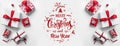 Merry Christmas Typographical On White Background With Gift Boxes And Red Decoration.