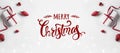 Merry Christmas Typographical on white background with gift boxes and red decoration. Royalty Free Stock Photo