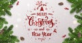 Merry Christmas Typographical on white background with tree branches, berries, gift boxes, stars, pine cones. Xmas and New Year Royalty Free Stock Photo