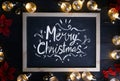 Merry Christmas Typography on Blackboard Between Light Bulbs and