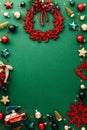 Merry Christmas vertical background. Vintage Christmas decorations, balls, stars, wreath on green table. Flat lay, top view, copy Royalty Free Stock Photo