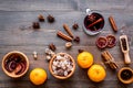 Merry christmas in winter evening with warm drink. Hot mulled wine or grog with fruits and spices on wooden background Royalty Free Stock Photo