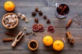 Merry christmas in winter evening with warm drink. Hot mulled wine or grog with fruits and spices on wooden background Royalty Free Stock Photo