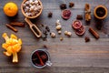 Merry christmas in winter evening with warm drink. Hot mulled wine or grog with fruits and spices on wooden background Royalty Free Stock Photo