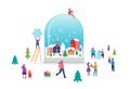 Merry Christmas, Winter wonderland scene in a snow globe with small people, young men and women, families having fun in Royalty Free Stock Photo