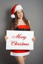 Merry christmas woman dressed in xmas costume and santa hat Royalty Free Stock Photo