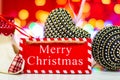 Merry Christmas wooden sign. Christmas composition on blurred lights background. Colorful Christmas balls Royalty Free Stock Photo