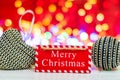 Merry Christmas wooden sign. Christmas composition on blurred lights background. Colorful Christmas balls Royalty Free Stock Photo