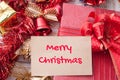 Merry christmas word on card and Christmas gift box with decorat Royalty Free Stock Photo